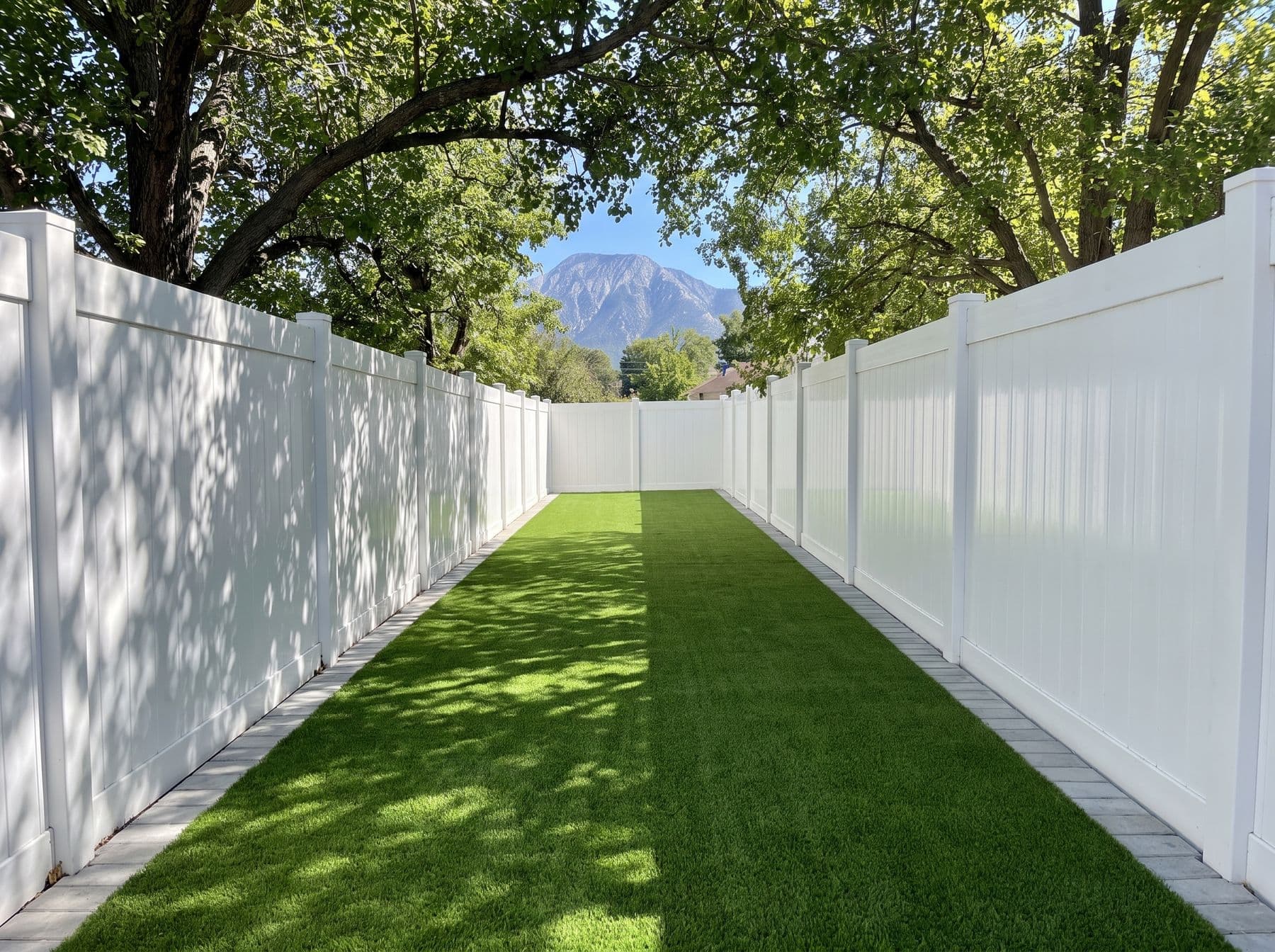 A narrow side yard converted from permanent mud to a clean run, photographed in a Holladay setting