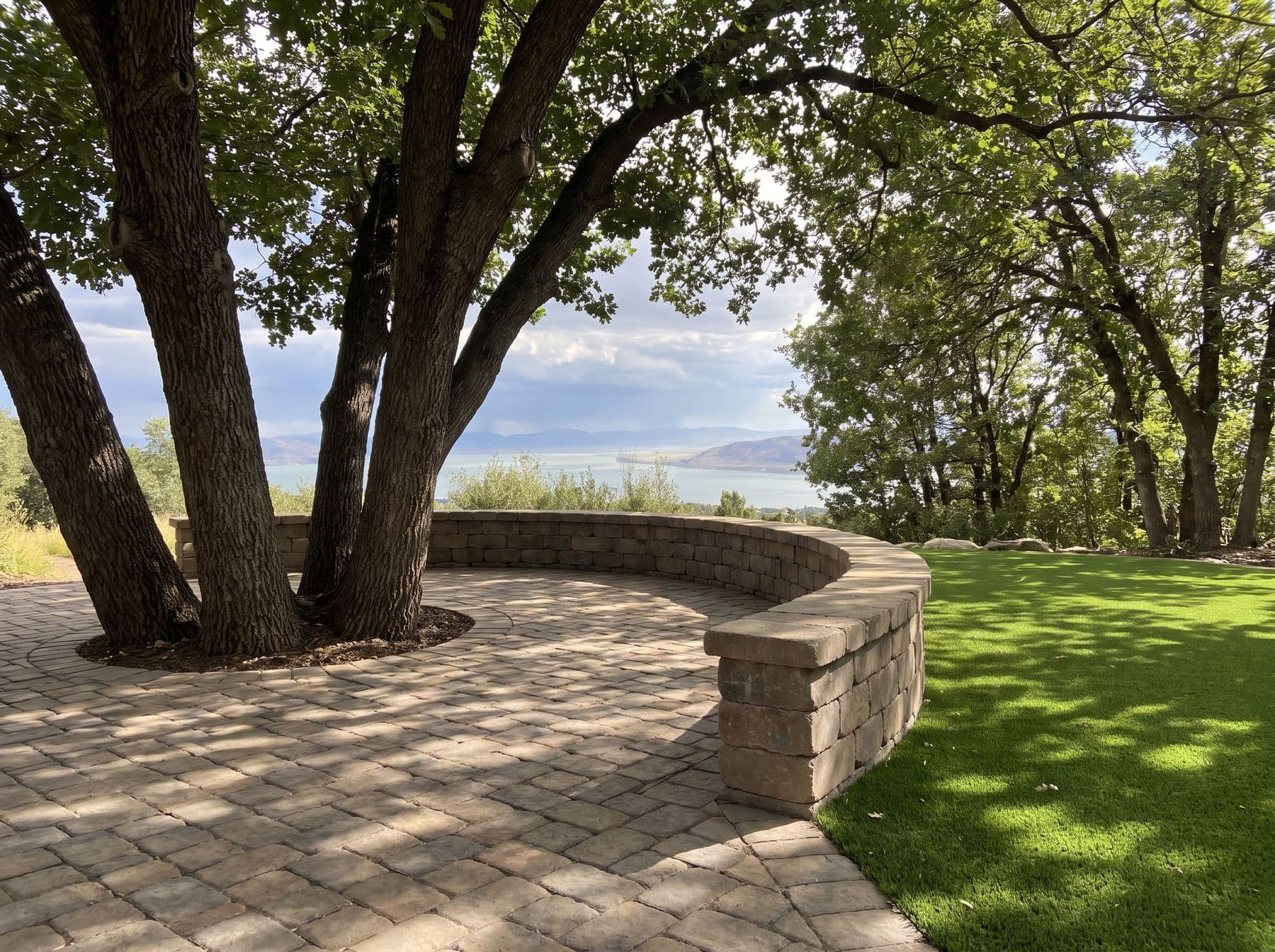 Finished artificial turf and hardscape work photographed in a Utah setting