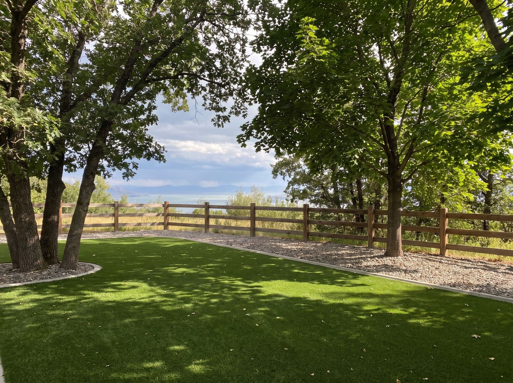 Finished artificial turf and hardscape work photographed in a Utah setting