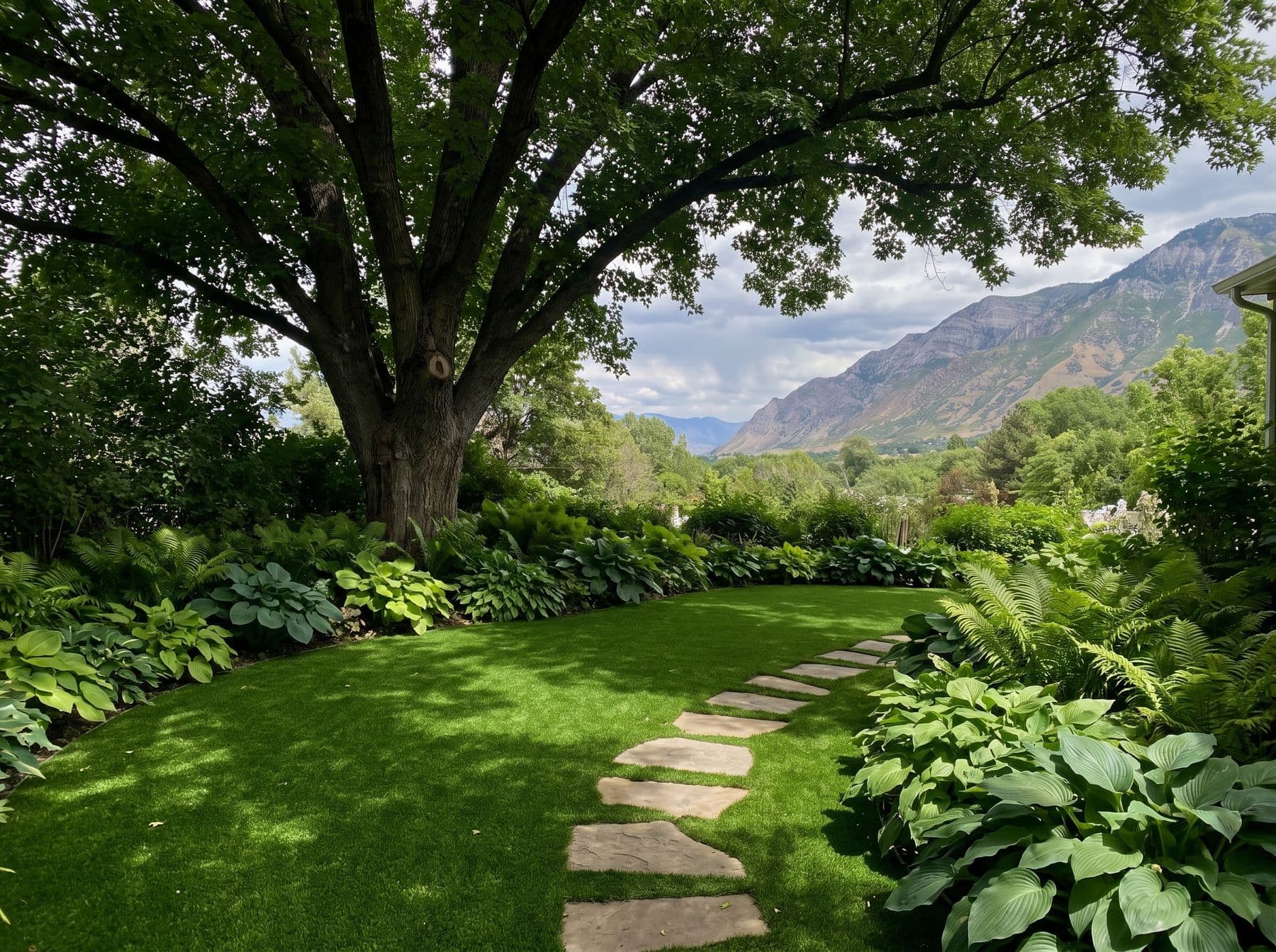 Finished artificial turf and hardscape work photographed in a Utah setting