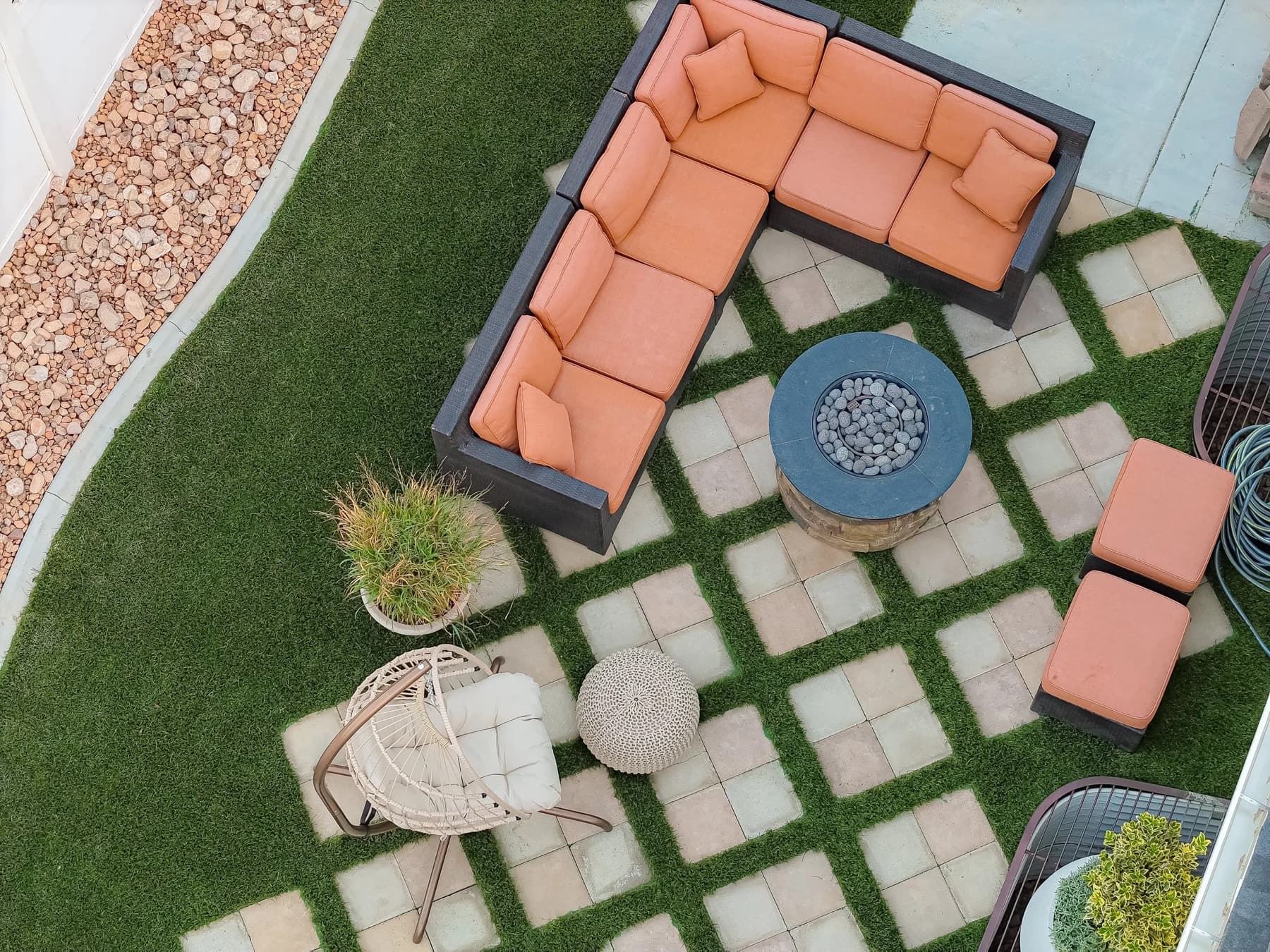 Artificial turf backyard photographed from above in evening light